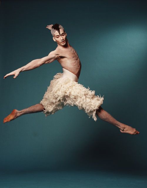 Jason Piper mid-leap in a Swan Lake ballet performance
