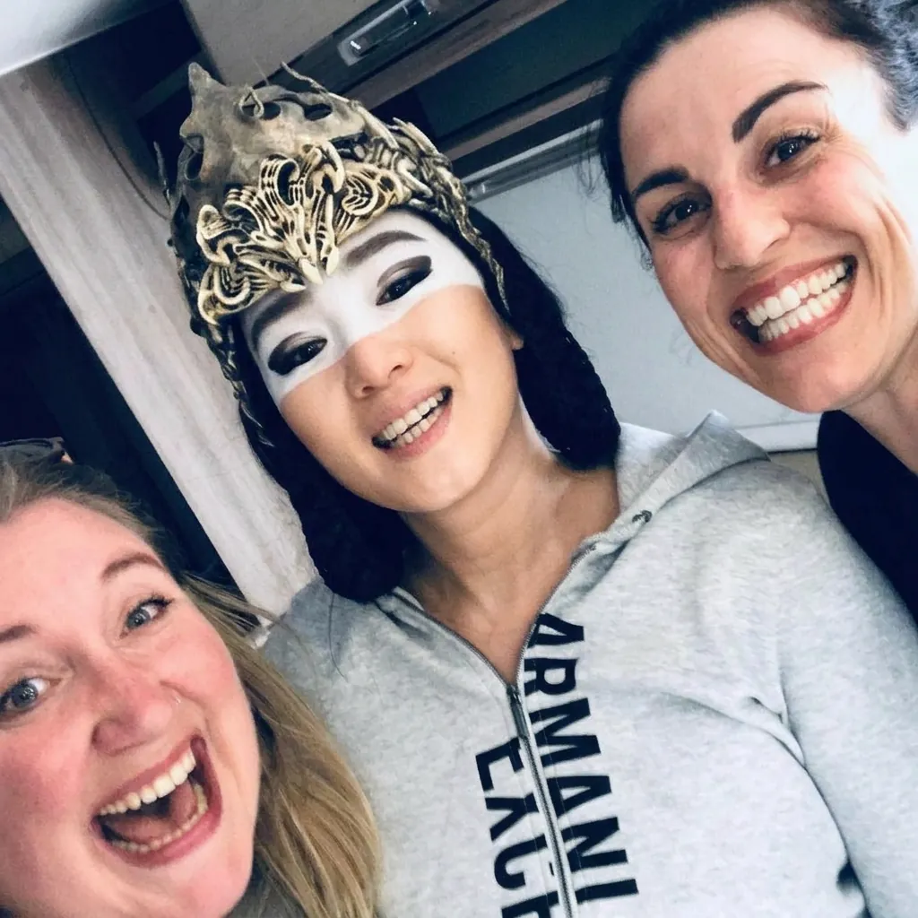 Sarah and Helen with cast member on Mulan set
